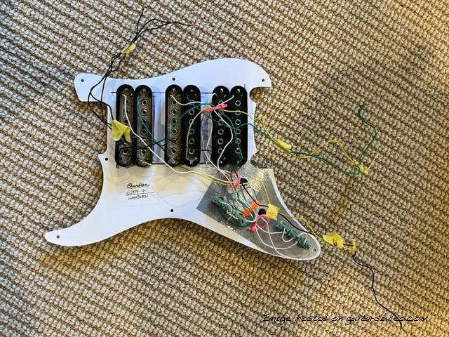 Back view of pickguard without potentiometers mounted.  Partially wired. 