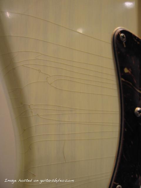 Closeup of finish cracks on body of Legacy Rustic