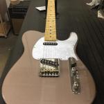 AC in shoreline gold with pearl guitar