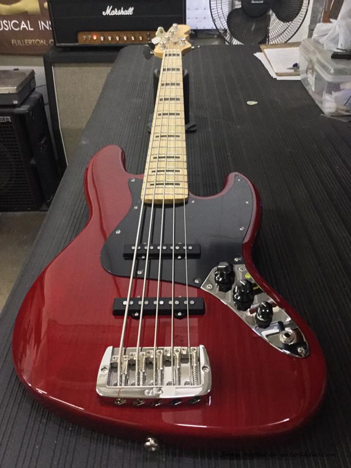 JB-5 in Clear Red over swamp ash black block inlays