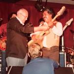 1982 - Leo Fender gives one of his new G&L guitars to the legendary Freddy Fender