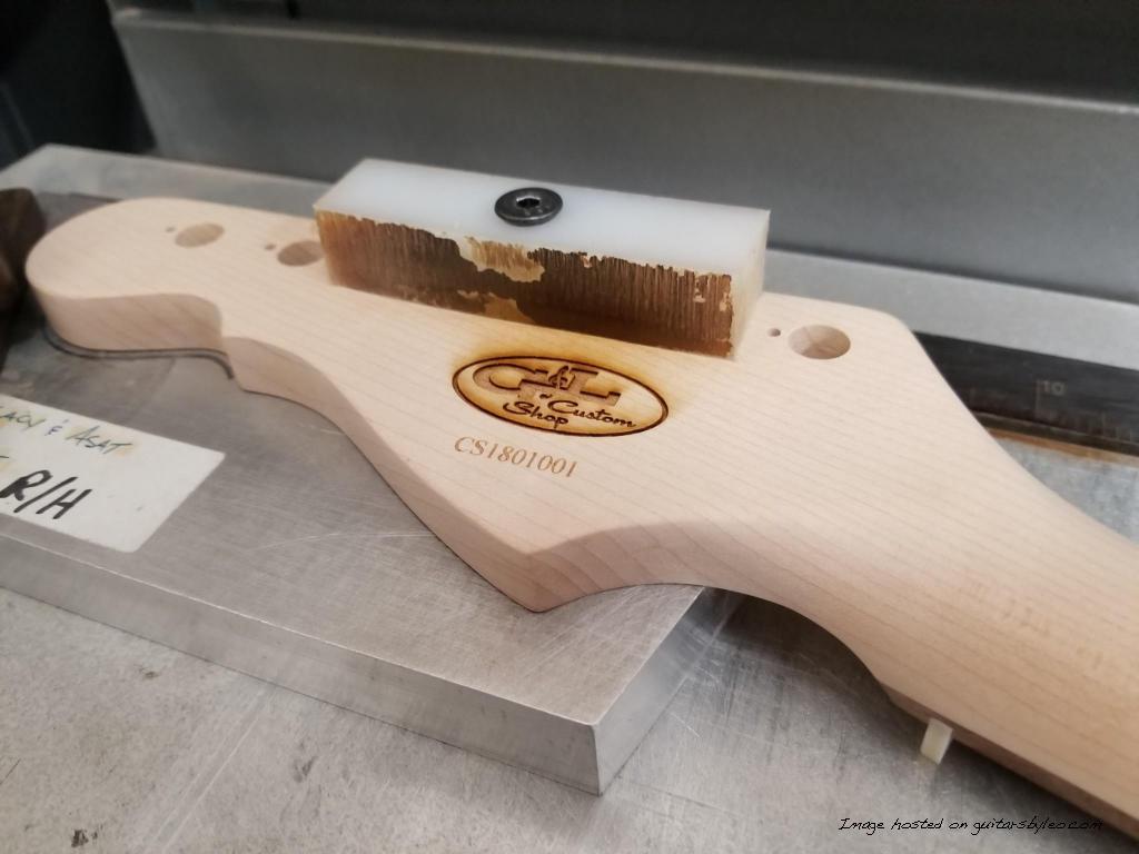 Jake's Custom Shop Legacy neck being laser engraved and serialized