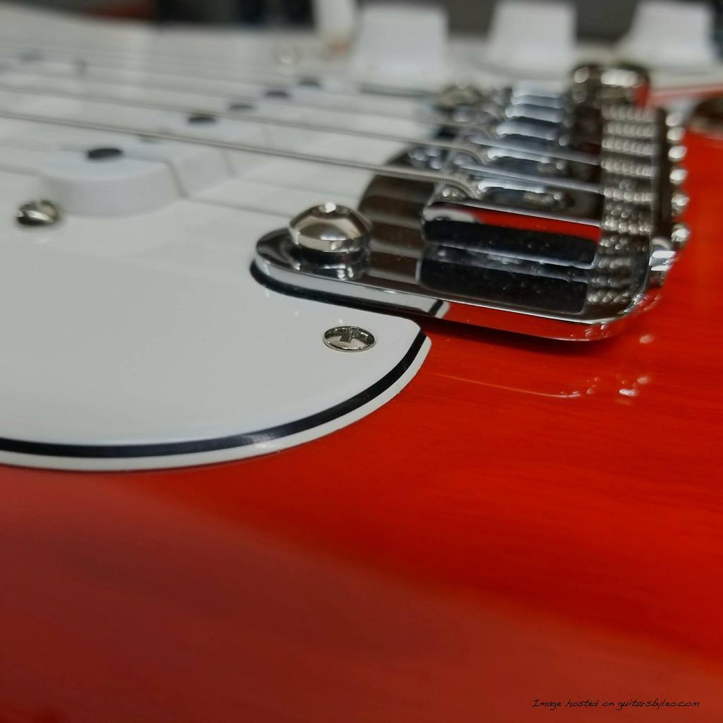 polished pickguard bevel of this Legacy guitar