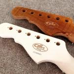 Quilted Maple logo and the other has a Mahogany inlaid logo