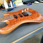 CS Legacy HSS RMC has a Redwood top over an Okoume body with a Caribbean Rosewood fretboard