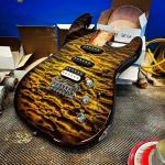 Custom Shop Legacy HSS RMC in Camo Burst over a 3A Quilted Maple top