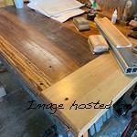 I noticed this bench getting more elaborate in its woodwork and I have no idea who or why