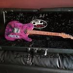 ASAT Classic done up in Trans Purple over Buckeye Burl with a natural Okoume back-1