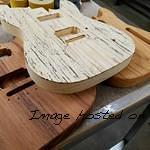 ASAT bodies in various exotic woods From left to right Guanacaste Spalted Maple top and Roasted Ash