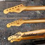 batch of necks done in vintage tint gloss awaiting logo decals